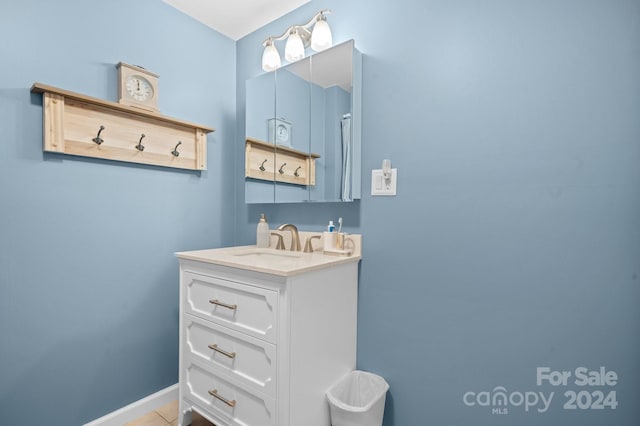 bathroom with tile patterned floors and vanity