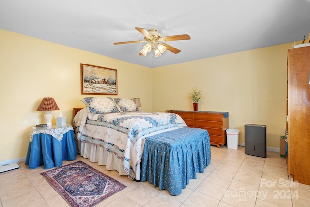 tiled bedroom featuring ceiling fan