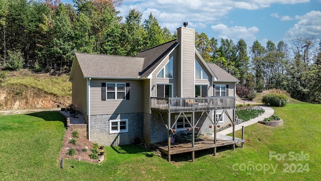 back of house with a deck and a yard