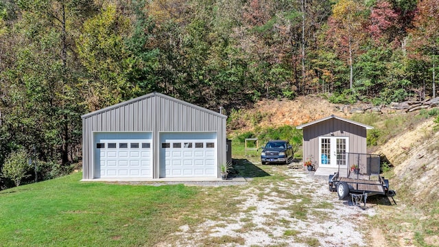 garage with a yard