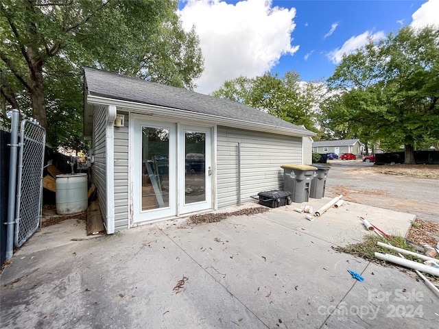 view of side of home with french doors and a patio