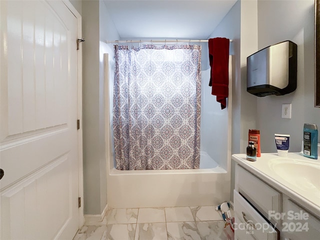 bathroom featuring vanity and shower / bath combo with shower curtain