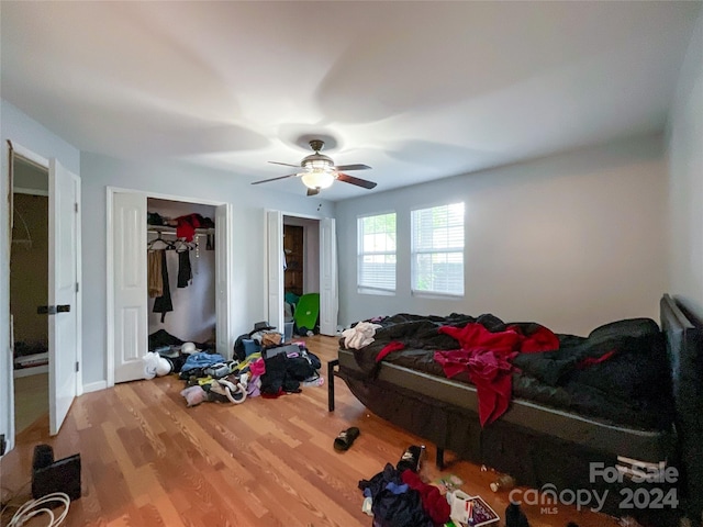 bedroom featuring ceiling fan and hardwood / wood-style floors