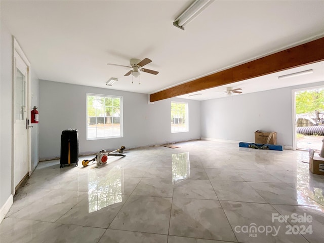 unfurnished room with beam ceiling and ceiling fan