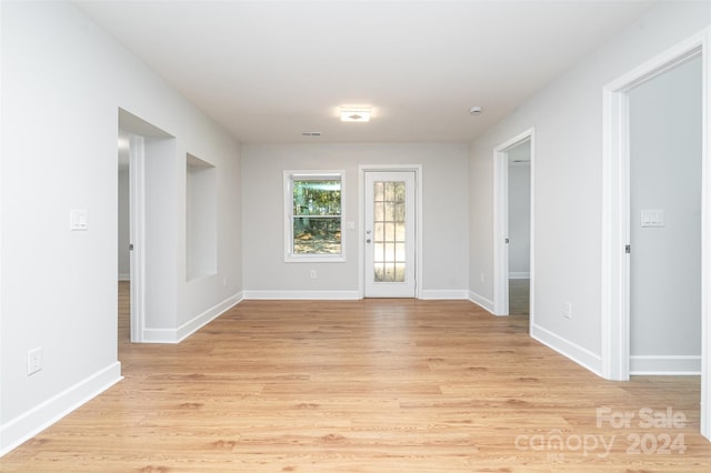 unfurnished room with light hardwood / wood-style floors