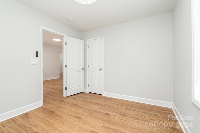 unfurnished room featuring light hardwood / wood-style floors