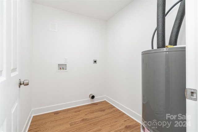 laundry room featuring hookup for a washing machine, water heater, hookup for an electric dryer, and hardwood / wood-style floors