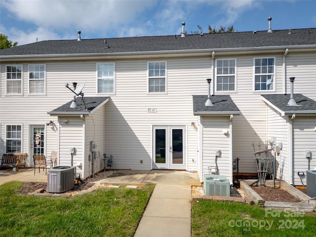 rear view of property with a patio area and central AC unit