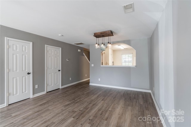 empty room with hardwood / wood-style floors