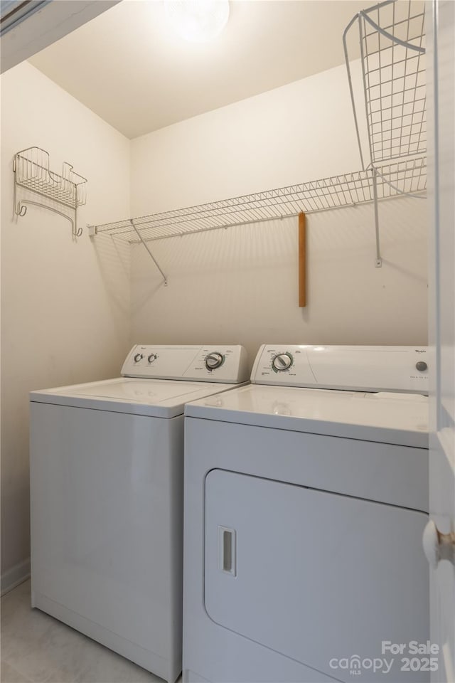 washroom featuring washer and dryer