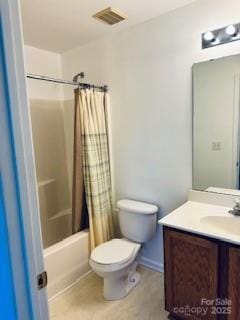 full bathroom featuring shower / tub combo with curtain, vanity, and toilet