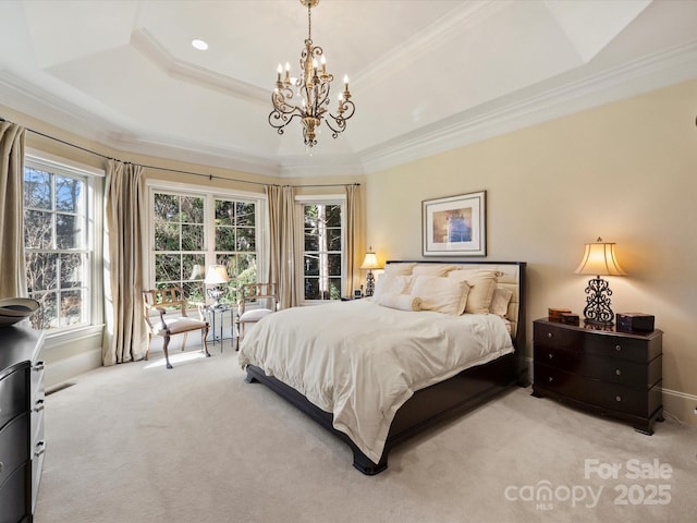 bedroom with light carpet, ornamental molding, a chandelier, and a tray ceiling