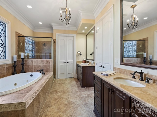 bathroom featuring an inviting chandelier, crown molding, separate shower and tub, and vanity