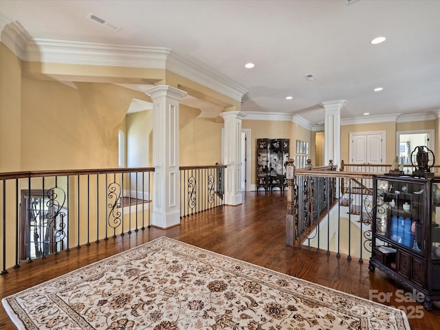 hall with ornamental molding and dark hardwood / wood-style flooring