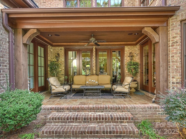 property entrance with ceiling fan, outdoor lounge area, and french doors