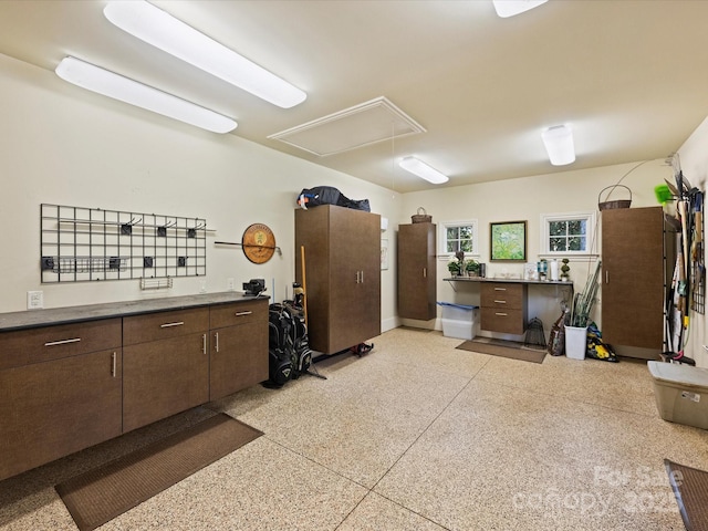 kitchen featuring dark brown cabinetry