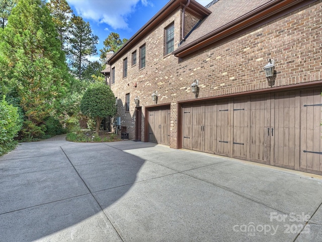 view of property exterior featuring a garage