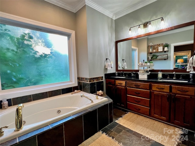 bathroom with tiled tub, vanity, and ornamental molding