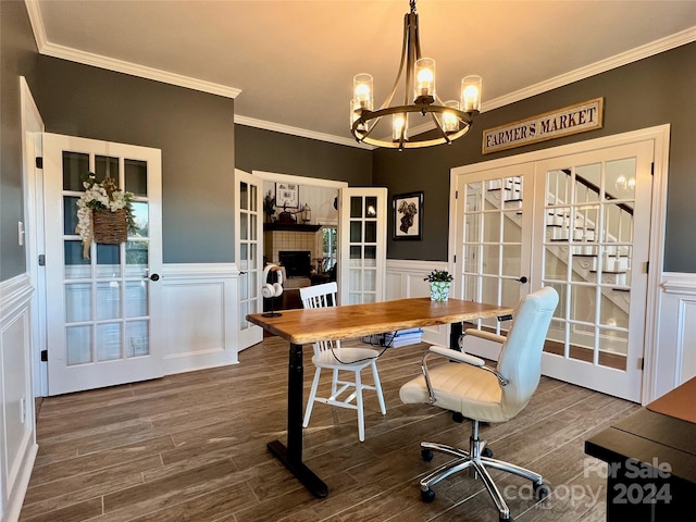 home office featuring crown molding, a tile fireplace, french doors, and dark hardwood / wood-style floors