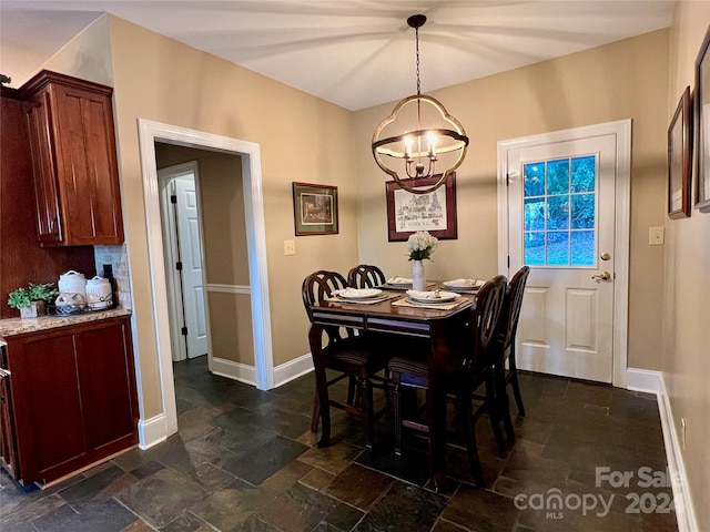 dining area featuring an inviting chandelier