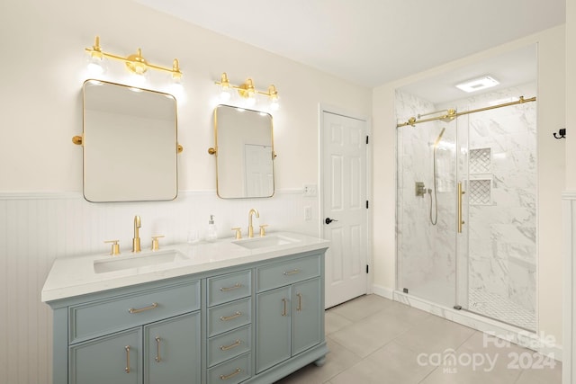 bathroom with vanity, a shower with shower door, and tile patterned flooring