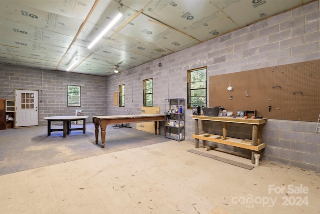 recreation room featuring concrete flooring