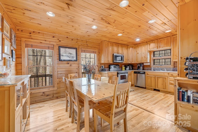 dining room with recessed lighting, light wood-style flooring, and wooden ceiling