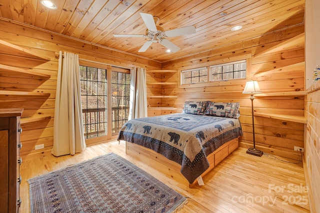 bedroom with wooden walls, recessed lighting, wooden ceiling, and wood-type flooring
