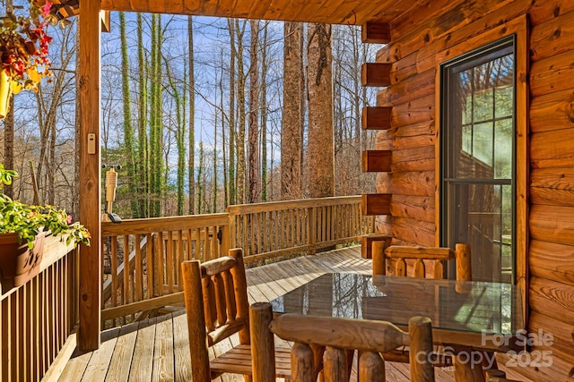 deck with outdoor dining space