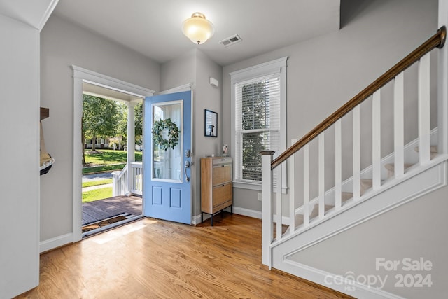 entryway with plenty of natural light and light hardwood / wood-style floors