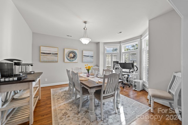 dining area with hardwood / wood-style floors