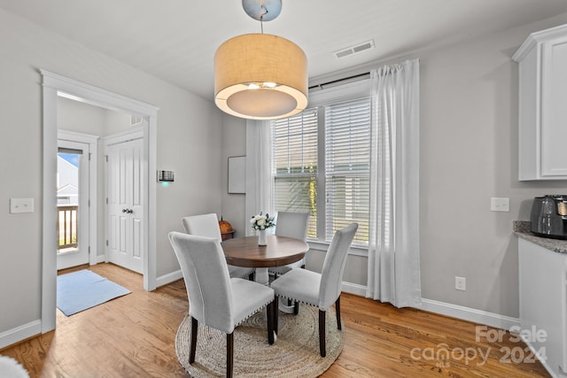 dining area with light wood-type flooring