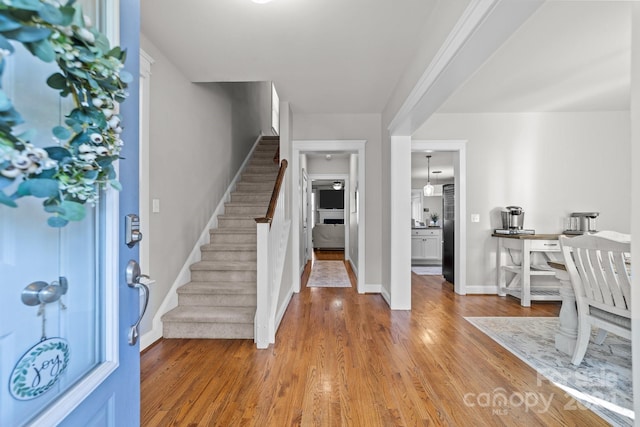 foyer entrance with hardwood / wood-style flooring