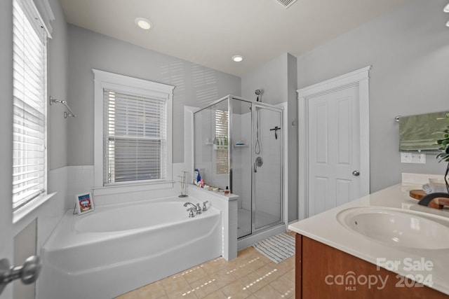 bathroom with vanity, separate shower and tub, and tile patterned floors