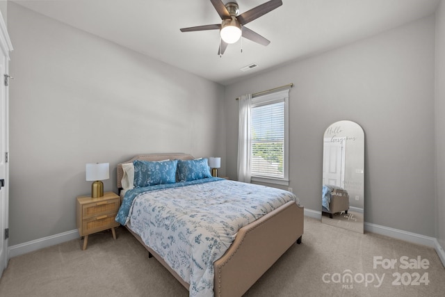 carpeted bedroom with ceiling fan