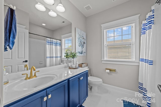 bathroom featuring vanity, tile patterned flooring, toilet, and curtained shower