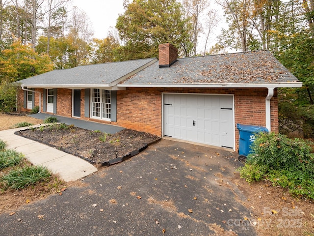 ranch-style house featuring a garage and a porch