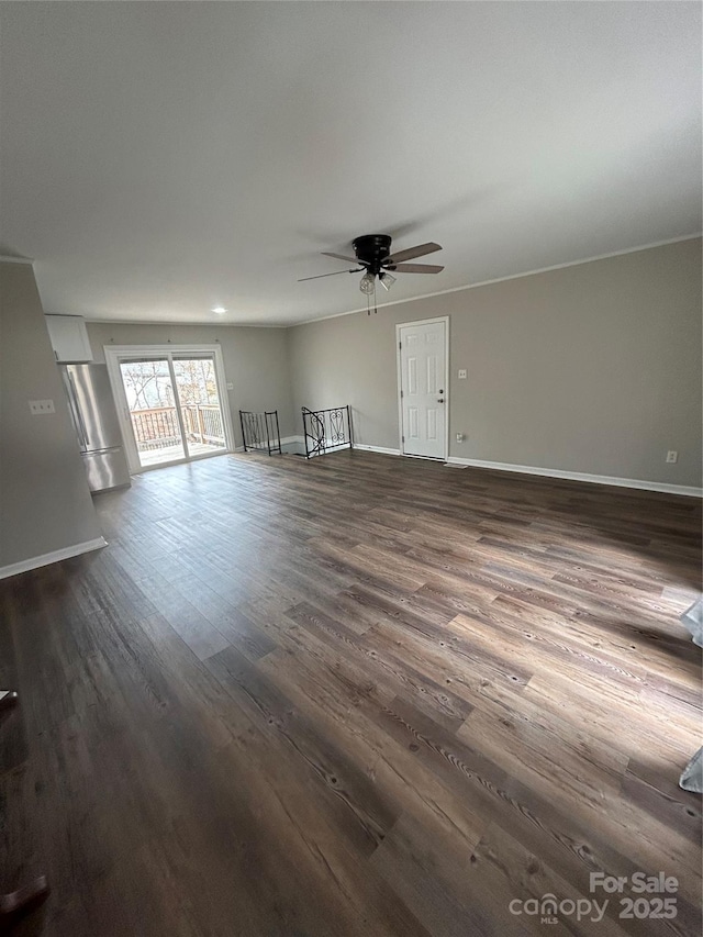 unfurnished living room featuring dark hardwood / wood-style flooring and ceiling fan