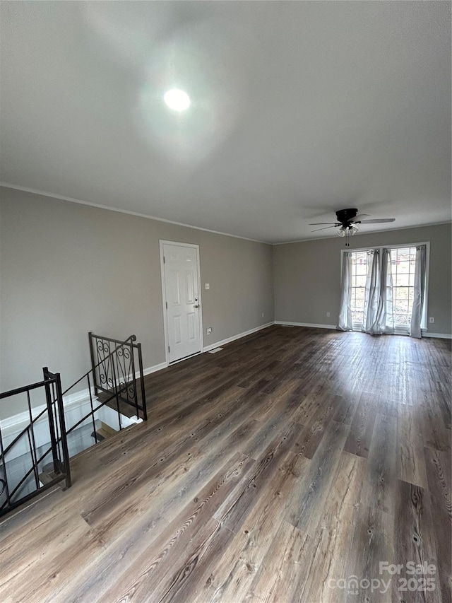 unfurnished room with hardwood / wood-style floors and ceiling fan