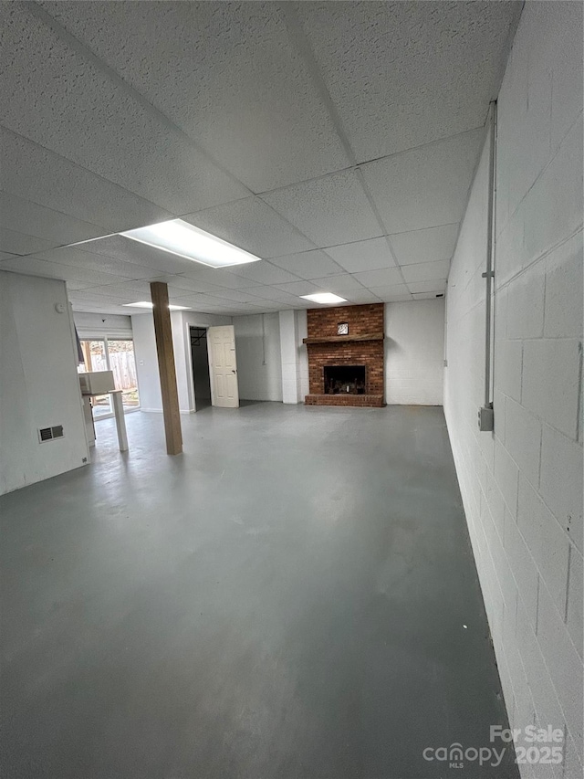 basement featuring a paneled ceiling