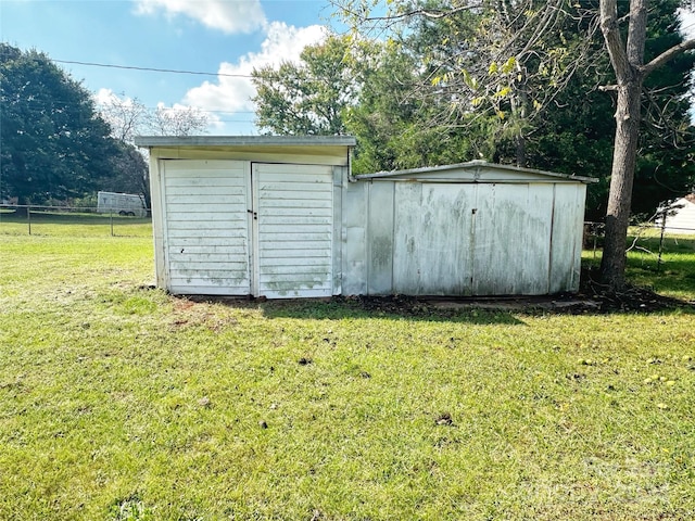 view of outdoor structure with a yard