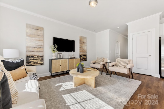 living room featuring crown molding and dark hardwood / wood-style flooring