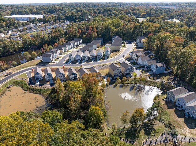 504 Kingsway Cir, Charlotte, NC 28214 - aerial view of property and surrounding area with a large body of water, nearby suburban area, and a heavily wooded area