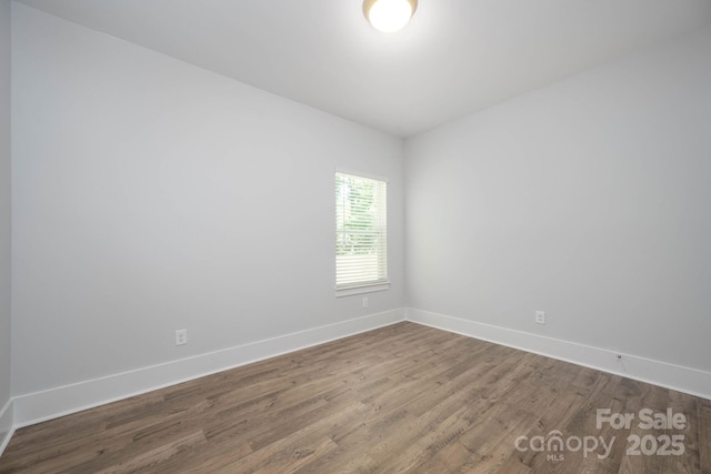 spare room featuring hardwood / wood-style flooring