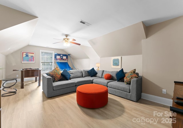 living room with ceiling fan, light hardwood / wood-style floors, and lofted ceiling