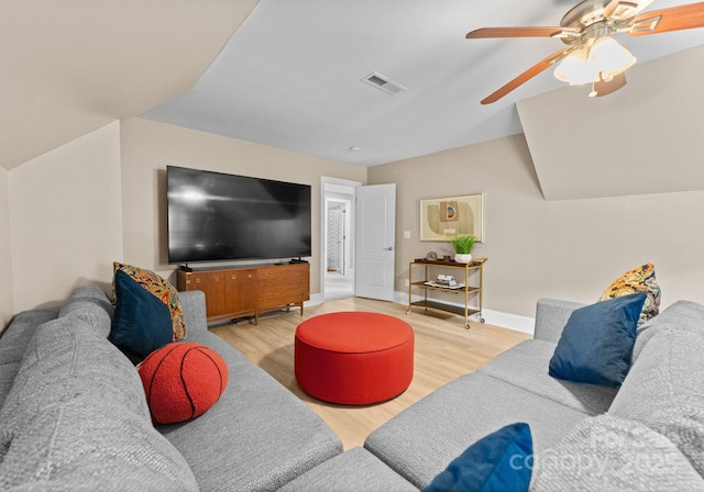 living room with ceiling fan and light hardwood / wood-style floors