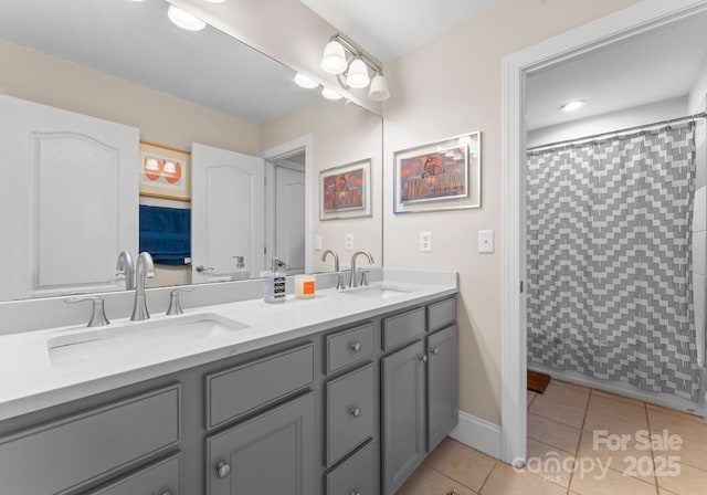 bathroom with tile patterned flooring, vanity, and curtained shower