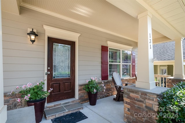 doorway to property with a porch