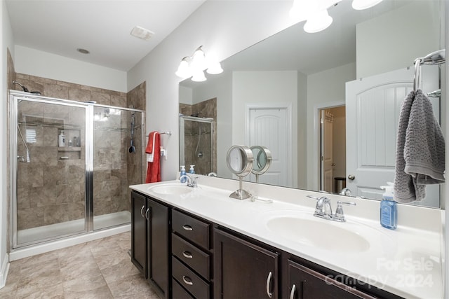 bathroom with walk in shower and vanity