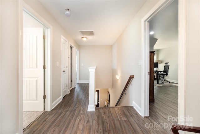 hallway featuring dark hardwood / wood-style floors